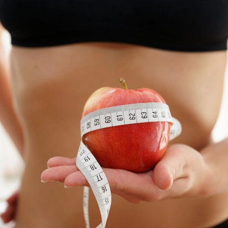 Weight Loss Lexington KY Woman Holding Apple