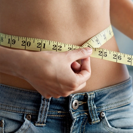 Weight Loss Lexington KY Woman In Jeans Measuring Waist